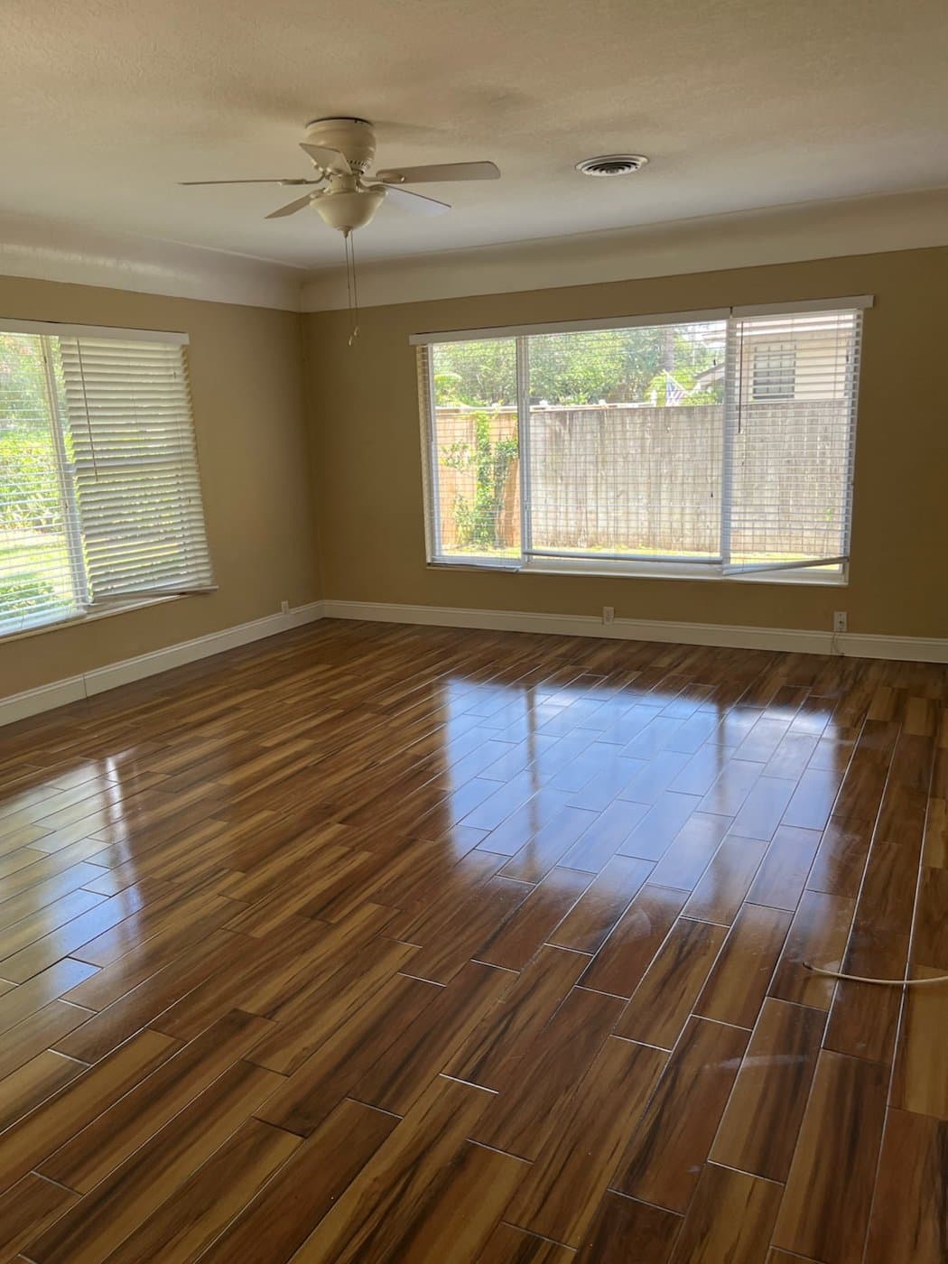 Empty home with polished wood floors after a move-out clean